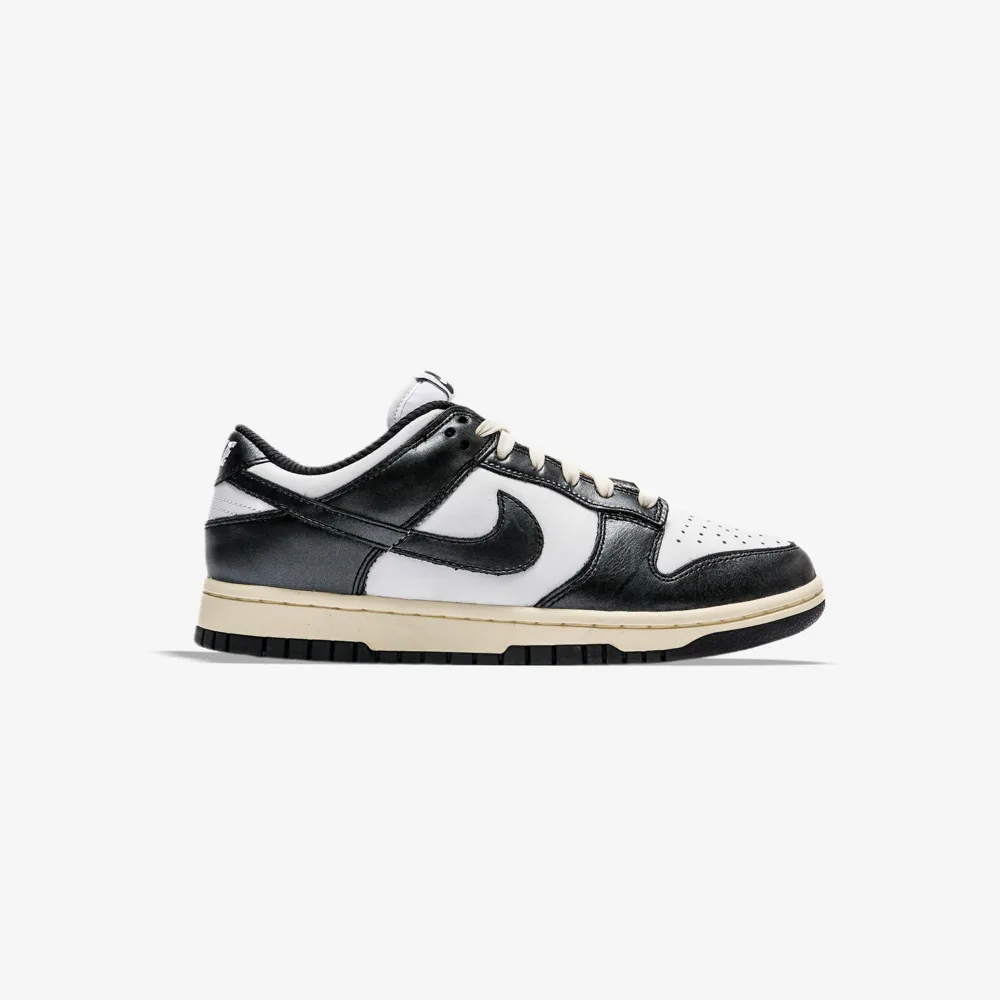کتونی اورجینال برند Nike مدل Dunk Low PRM Vintage Panda رنگ سفید و مشکی از نمای بغل