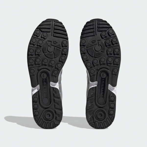 کتونی اورجینال برند Adidas مدل Flux رنگ خاکستری با جزئیات مشکی نمای زیره